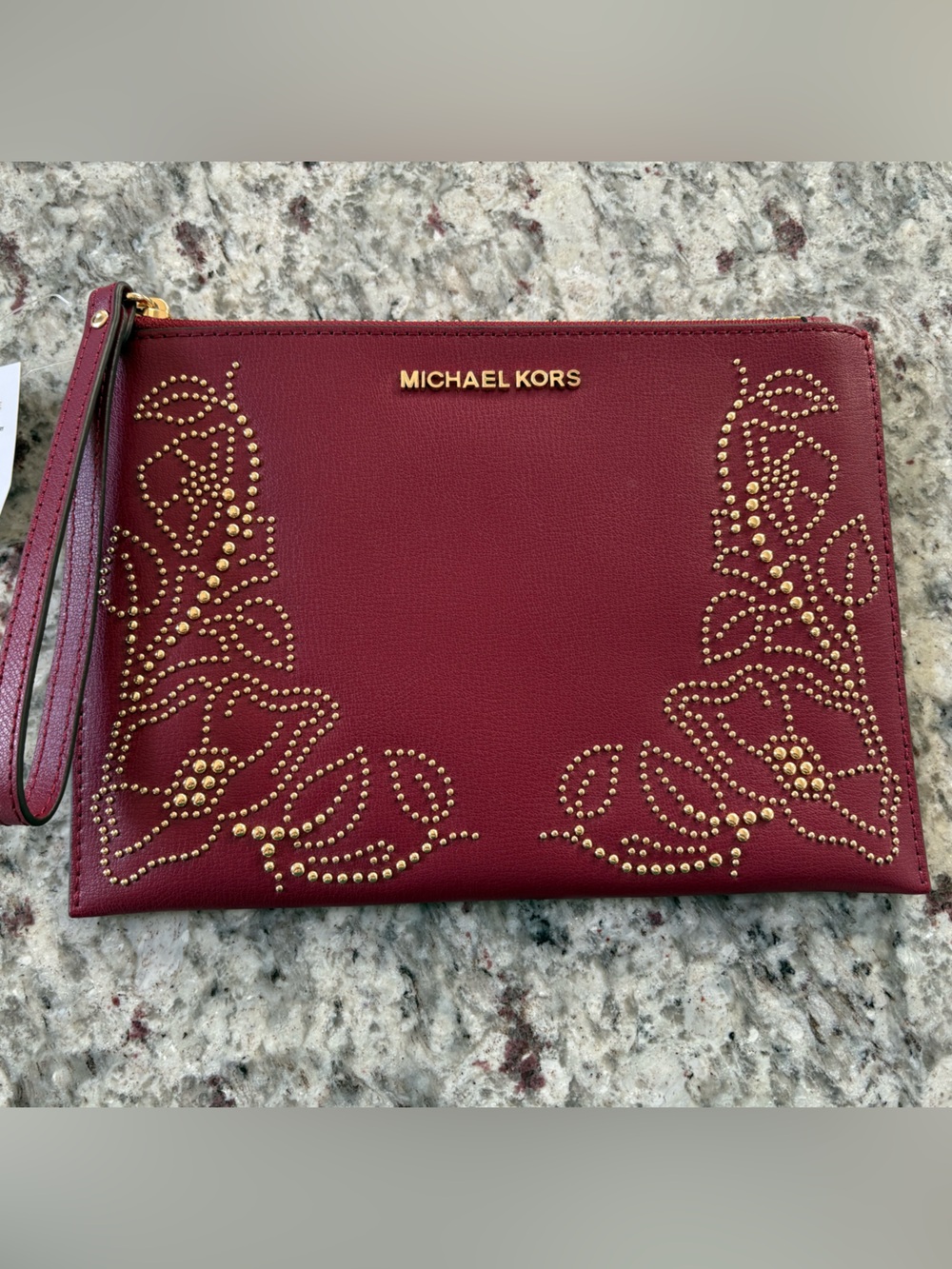 Michael Kors Burgundy Wristlet with Gold Stud Floral Detail